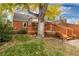 Large backyard with deck, mature tree, and shed at 1545 Newport St, Denver, CO 80220