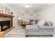 Finished basement with sectional sofa and fireplace at 1545 Newport St, Denver, CO 80220