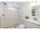 Clean and updated basement bathroom with a walk-in shower at 1545 Newport St, Denver, CO 80220