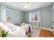 Bedroom with a queen bed and light blue walls at 1545 Newport St, Denver, CO 80220