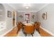 Bright dining room features a wood table with leather chairs and hardwood floors at 1545 Newport St, Denver, CO 80220