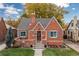 Charming brick house with blue shutters at 1545 Newport St, Denver, CO 80220