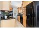 Modern kitchen with granite countertops and light wood cabinets at 1545 Newport St, Denver, CO 80220