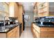 Modern kitchen with granite countertops and light wood cabinets at 1545 Newport St, Denver, CO 80220