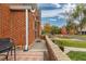 Brick home with side patio and street view at 1545 Newport St, Denver, CO 80220