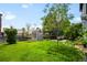 Backyard includes a storage shed, landscaping, and a lush green lawn at 19716 Glendale Ln, Parker, CO 80134