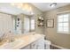 Bathroom featuring double sinks, a large mirror, and ample counter space, perfect for a busy Gathering at 19716 Glendale Ln, Parker, CO 80134