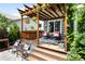 Covered deck with comfortable seating, a grill, and decorative accents at 19716 Glendale Ln, Parker, CO 80134