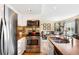 Bright kitchen featuring stainless steel appliances and a view into the living room at 19716 Glendale Ln, Parker, CO 80134