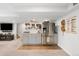 Basement kitchenette includes a stainless steel refrigerator and a modern design at 19716 Glendale Ln, Parker, CO 80134