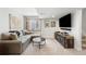 Finished basement living room features a TV, comfortable seating, and neutral decor at 19716 Glendale Ln, Parker, CO 80134