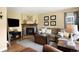 Cozy living room with a stone fireplace, comfortable seating, and natural light at 19716 Glendale Ln, Parker, CO 80134