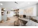 The finished basement living room includes a sectional sofa and an adjacent dining space at 19716 Glendale Ln, Parker, CO 80134