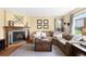 Comfortable living room featuring a stone fireplace and cozy seating area at 19716 Glendale Ln, Parker, CO 80134