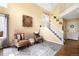 Inviting living room featuring comfortable seating, a staircase, and natural light at 19716 Glendale Ln, Parker, CO 80134