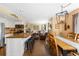 Open-concept kitchen, dining, and living spaces featuring modern decor and natural light at 19716 Glendale Ln, Parker, CO 80134