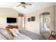 Another angle of the serene bedroom with vaulted ceilings and plush carpet, complete with an ensuite bathroom at 19716 Glendale Ln, Parker, CO 80134