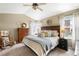 Serene bedroom with a large window, vaulted ceilings, and plush carpet creating a relaxing retreat at 19716 Glendale Ln, Parker, CO 80134