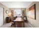 Bright office space with natural light, a spacious desk, and serene decor at 19716 Glendale Ln, Parker, CO 80134