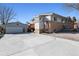 Spacious backyard with a detached garage, back patio, and additional parking for a boat or RV at 6409 Brentwood St, Arvada, CO 80004