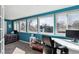 Bright and airy bedroom with large windows, desk, and a cozy bed, perfect for relaxation and study at 6409 Brentwood St, Arvada, CO 80004