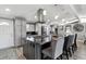 Spacious kitchen featuring a large island with seating, stainless steel appliances, and plenty of storage at 6409 Brentwood St, Arvada, CO 80004