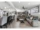 Open-concept kitchen and living room with modern design, comfortable seating, and ample space for entertaining guests at 6409 Brentwood St, Arvada, CO 80004