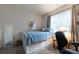 Comfortable bedroom featuring a bed with storage and a well-lit study area at 8338 S Independence Cir # 108, Littleton, CO 80128