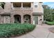 Charming condo with stone accents, covered porch, and well-maintained landscaping at 8338 S Independence Cir # 108, Littleton, CO 80128