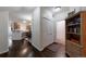 Inviting hallway with hardwood floors that lead to the kitchen and other living areas at 8338 S Independence Cir # 108, Littleton, CO 80128