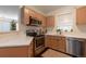 Kitchen featuring stainless steel appliances and ample counter space at 8338 S Independence Cir # 108, Littleton, CO 80128
