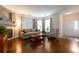 Inviting living room with fireplace, hardwood floors, and large windows at 8338 S Independence Cir # 108, Littleton, CO 80128