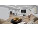Finished basement boasts a large entertainment area, built-in shelving, and adjacent workout space at 13804 Quail Ridge Dr, Broomfield, CO 80020