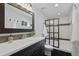 Bathroom features a modern glass enclosed shower, sleek vanity, and contemporary fixtures at 13804 Quail Ridge Dr, Broomfield, CO 80020