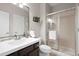 Modern bathroom with a glass-enclosed shower, vanity, and neutral color scheme at 13804 Quail Ridge Dr, Broomfield, CO 80020