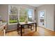 Charming dining area with a large window, wood floors, and access to outdoor space at 13804 Quail Ridge Dr, Broomfield, CO 80020