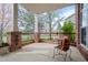 Inviting front porch with brick accents, cozy seating, and a charming neighborhood view at 13804 Quail Ridge Dr, Broomfield, CO 80020