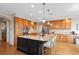 Gourmet kitchen with a granite island, stainless steel appliances, and custom cabinetry at 13804 Quail Ridge Dr, Broomfield, CO 80020