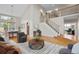 Bright living room with vaulted ceilings, hardwood floors, and a staircase with iron railing at 13804 Quail Ridge Dr, Broomfield, CO 80020