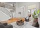 Bright living room with vaulted ceilings, hardwood floors, and multiple windows letting in natural light at 13804 Quail Ridge Dr, Broomfield, CO 80020