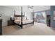 Spacious main bedroom with a four post bed frame, ceiling fan, and large window at 13804 Quail Ridge Dr, Broomfield, CO 80020
