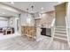 Basement bar boasts a brick backsplash, pendant lighting, seating for four, and convenient beverage fridge at 15389 W 50Th Dr, Golden, CO 80403
