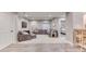 Finished basement featuring a comfortable sitting area with plush carpeting and an adjacent bedroom entrance at 15389 W 50Th Dr, Golden, CO 80403