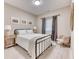 Cozy bedroom with neutral tones, three piece framed art, and carpeted flooring at 15389 W 50Th Dr, Golden, CO 80403