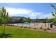 Community pool with a picnic shelter, playground area, and beautiful views of the surrounding hills at 15389 W 50Th Dr, Golden, CO 80403