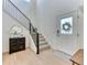 Inviting entryway featuring a staircase, light wood floors, and natural light at 15389 W 50Th Dr, Golden, CO 80403