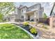 Stylish two-story home with manicured landscaping, stone accents, and a welcoming front porch at 15389 W 50Th Dr, Golden, CO 80403