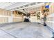 Spacious garage with plenty of storage, well lit and clean interior, with shelving at 15389 W 50Th Dr, Golden, CO 80403
