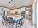 Modern kitchen boasting white cabinets, a center island, and stainless steel appliances at 15389 W 50Th Dr, Golden, CO 80403