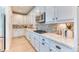Kitchen featuring white cabinets, stainless steel appliances, and granite countertops at 15389 W 50Th Dr, Golden, CO 80403